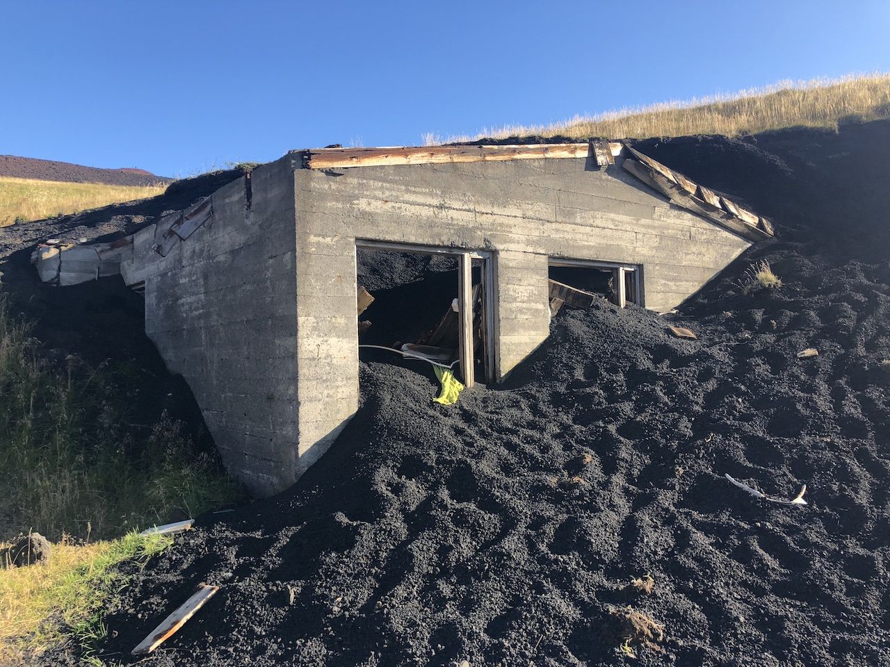 Building buried in ash at the Eldfell volcano in Iceland