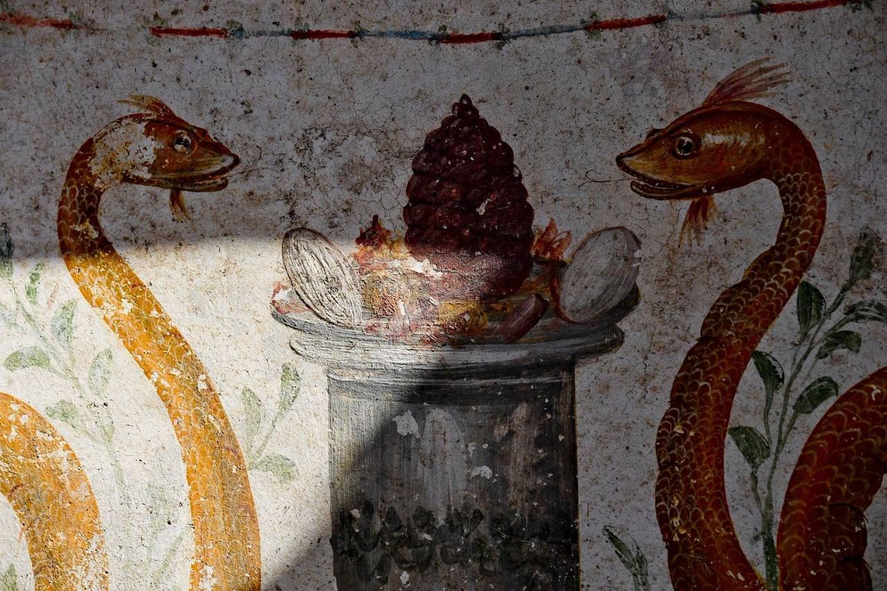 Paints on the walls of a shrine in the ruins of Pompeii, Italy