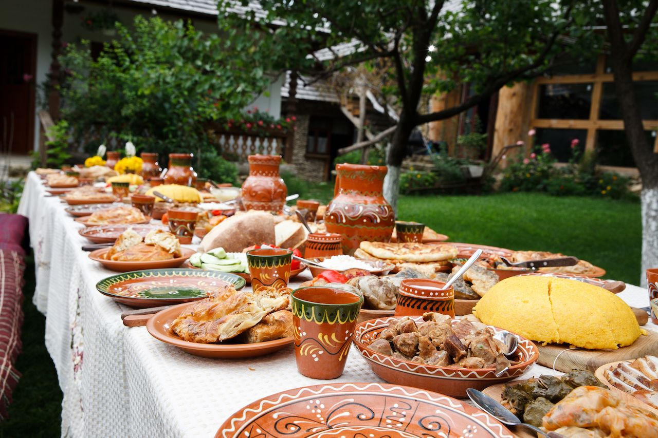 Long table piled with homemade Moldovan food